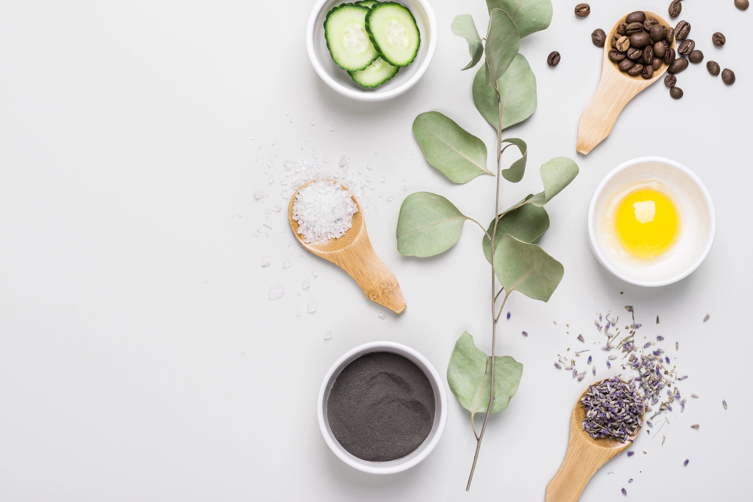 Natural DIY skincare ingredients in bowls