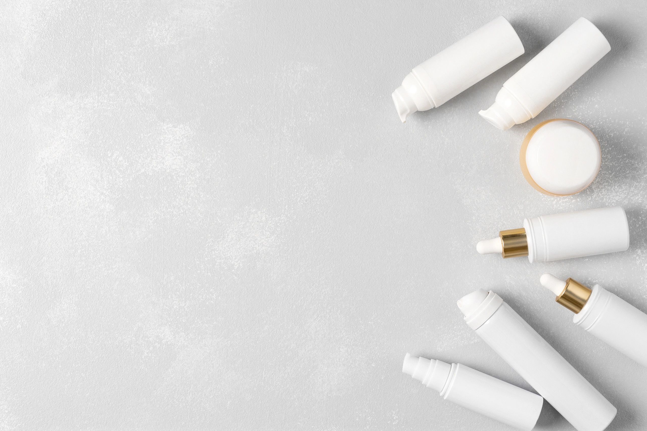 Skincare products arranged with clean copy space